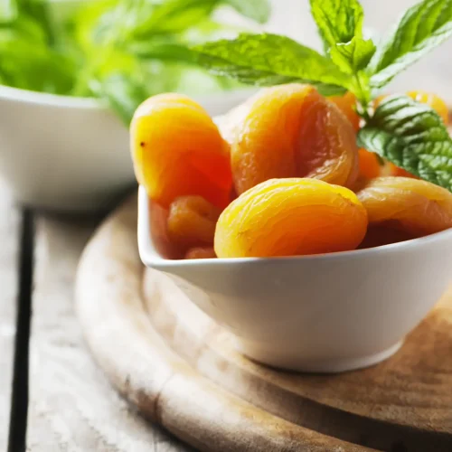 sweet-dried-apricots-and-mint-on-the-wooden-table-2021-08-28-11-03-19-utc-scaled